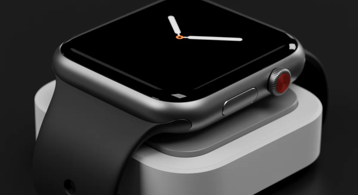 Coroa Digital e botão lateral aprimorados do Apple Watch Series 11 em base de carregamento.